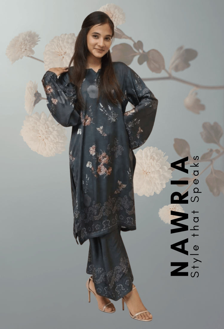 Woman wearing a floral dress with 'Nawria' branding on a gray background